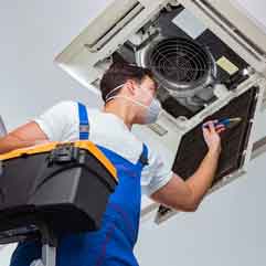 Team of Show Me Air Duct Cleaning technicians working on HVAC duct system
