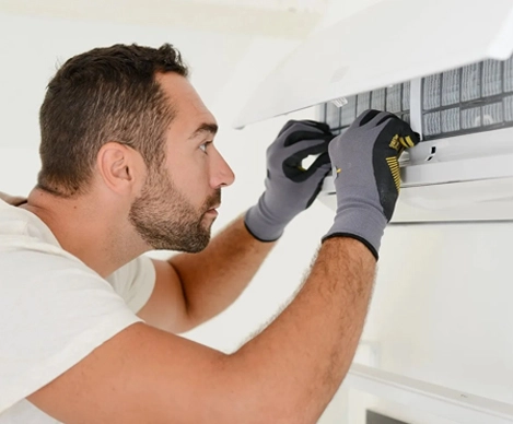 One technicians working on air duct system in O’Fallon MO
